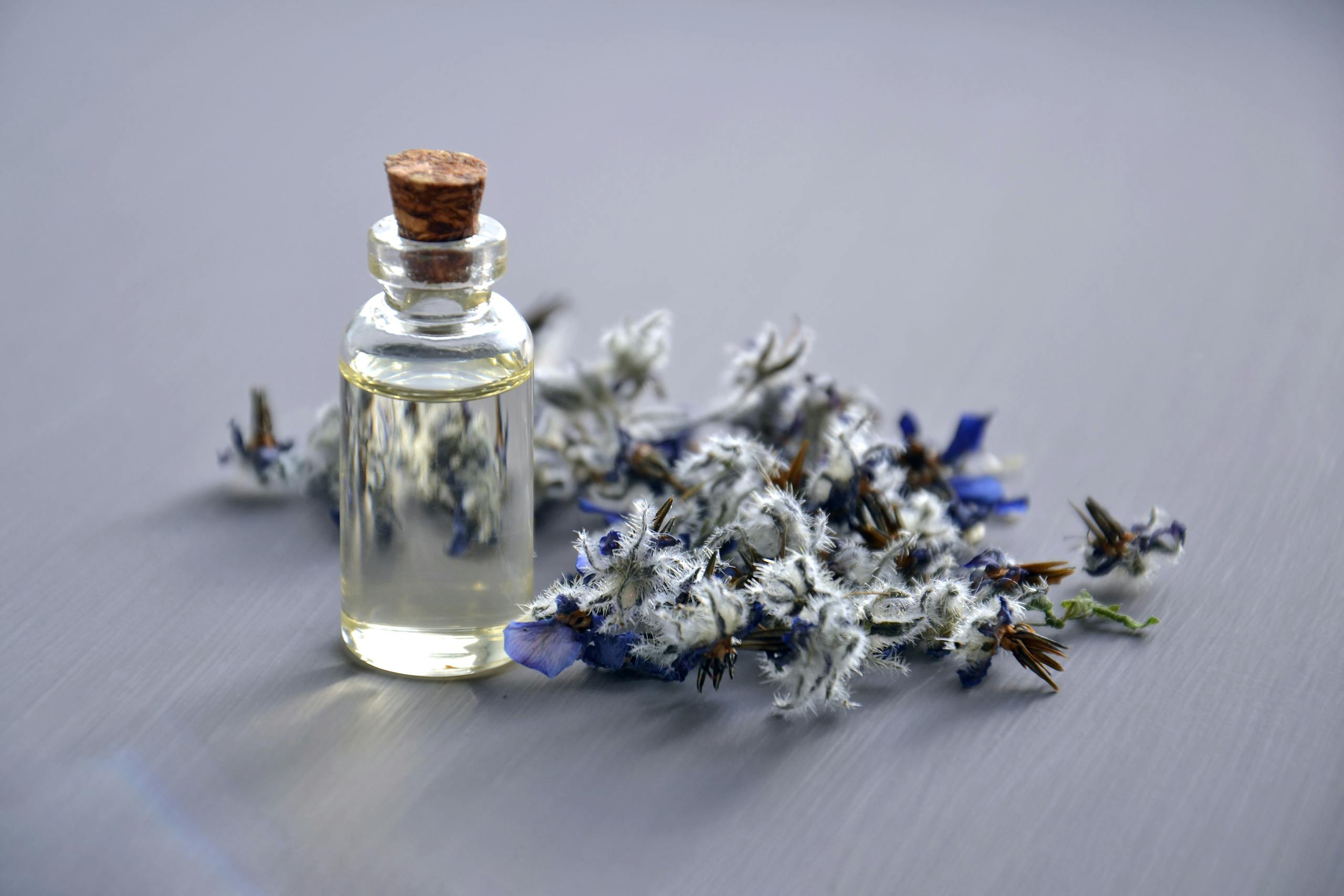 Selective Focus Photo of Bottle With Cork Lid